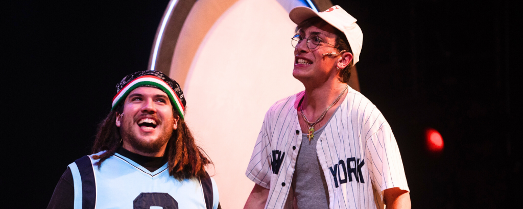 Rebels One & Two (Vincenzo Faruolo & Sol Ramirez) smiling big in sports jerseys for Connecticut Rep's production of The Old Man and The Old Moon (Fall 2024).