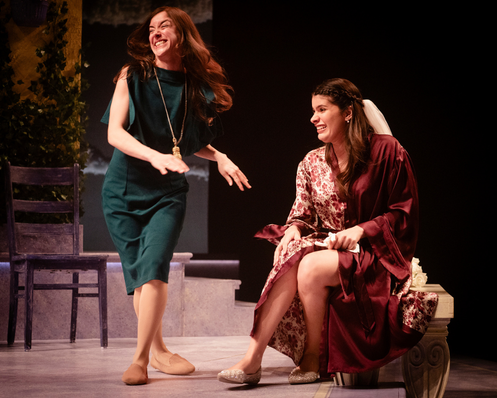 In a scene from Much Ado About Nothing, two young women are elated over upcoming nuptials.