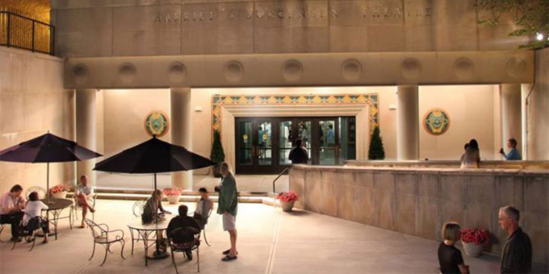 Exterior view of the Harriet S Jorgensen Theatre with patrons gathering out front.