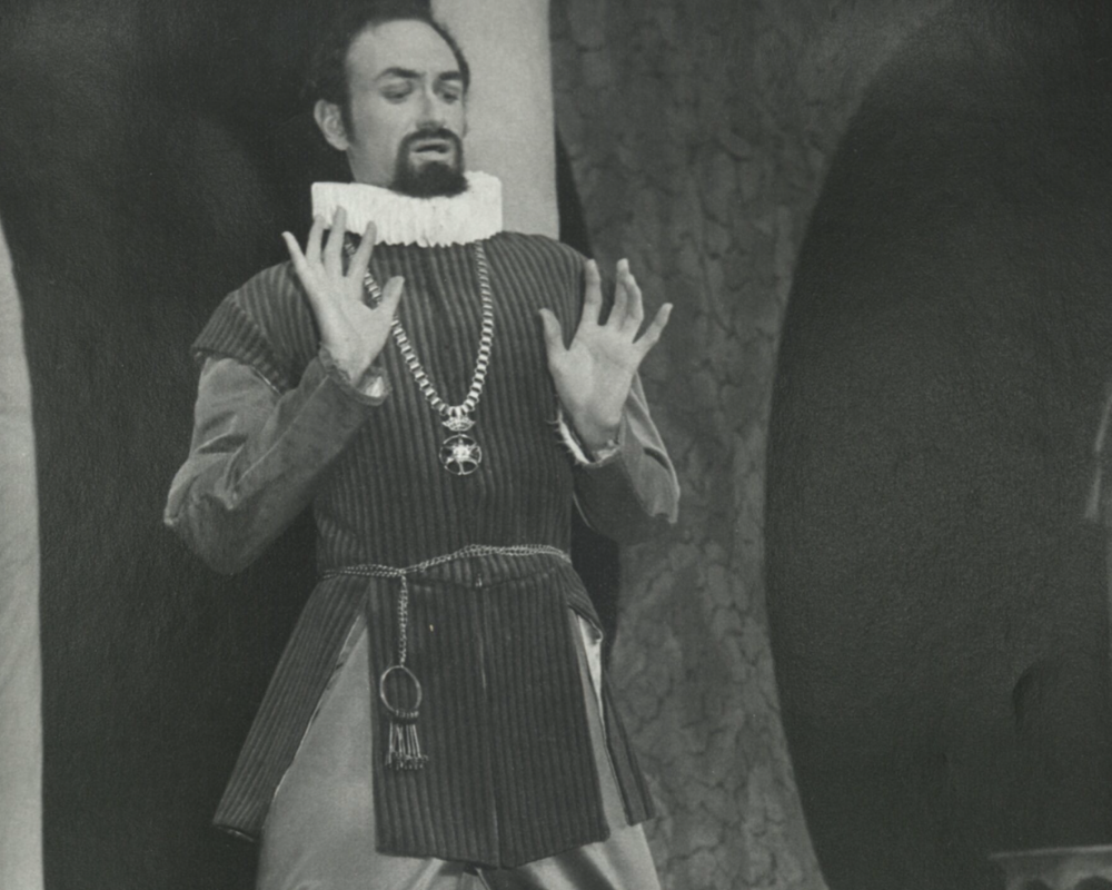 A gentleman donning an Elizabethan collar throws up his hands and takes a step back as if repulsed, in the 1978 production of Twelfth Night.