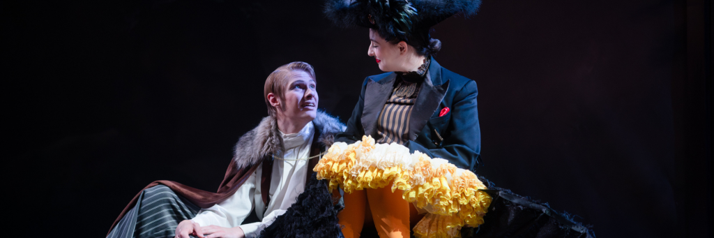 The Mastiff (Evan Wolfgang) taking comfort in A Moor-hen (Cipa Frost) from Connecticut Rep's production of The Moors (Fall 2024) while sitting next to one another.