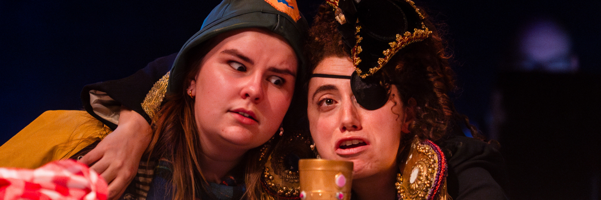 The Captain (Mel Carter) in pirate regalia pulling in The Old Man (Sadie Aiken) to deliver wisdom from Connecticut Rep's production of The Old Man and The Old Moon (Fall 2024).