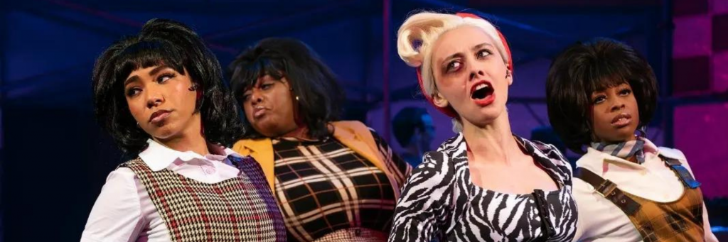From Connecticut Rep's Little Shop of Horrors (Spring 2022), Black street urchins Crystal, Ronnette, and Chiffon accompany a singing Audrey.
