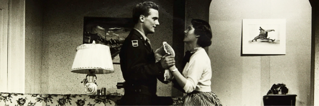 A young couple greet each other in the living room, in the CRT production of John Loves Mary in 1950.